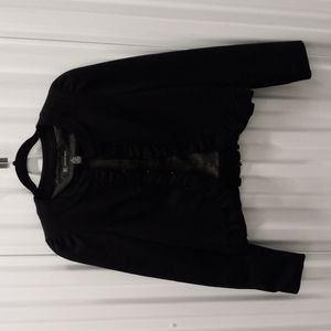 Bolero jacket with ruffles.